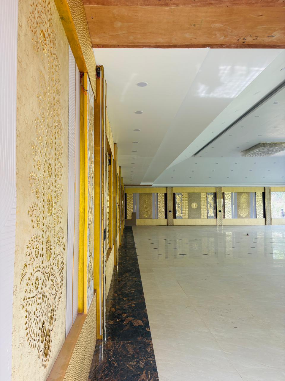 Long hall with gold drapes